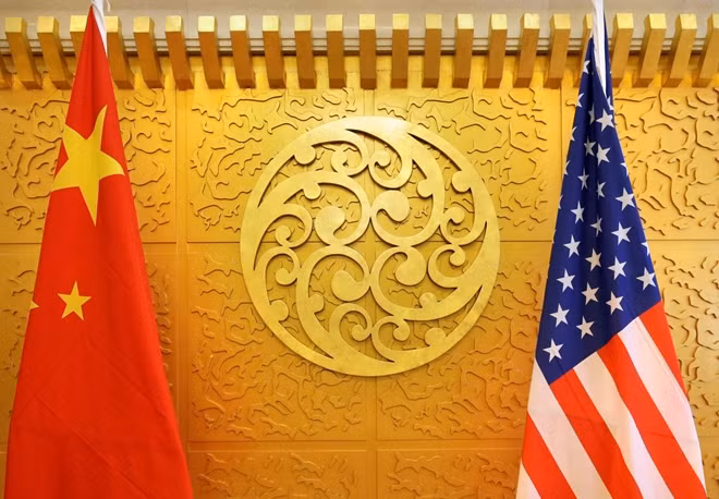 Chinese and U.S. flags are set up for a meeting during a visit by U.S. Secretary of Transportation Elaine Chao at China's Ministry of Transport in Beijing, China April 27, 2018. Picture taken April 27, 2018. REUTERS/Jason Lee/File Photo