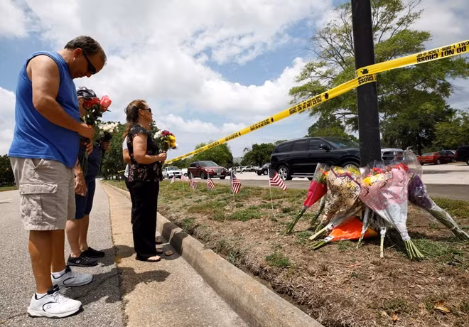 Vic Wirhowski, a local municipal worker, bows his head as he pays his respects at a makeshift memorial outside a municipal government building where a shooting incident occurred in Virginia Beach, Virginia, U.S. June 1, 2019.