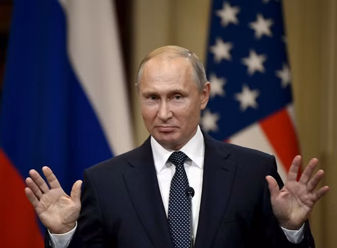 FILE PHOTO: Russia's President Vladimir Putin gestures during the joint press conference with U.S. President Donald Trump in the Presidential Palace in Helsinki, Finland July 16, 2018. Lehtikuva/Jussi Nukari via REUTERS