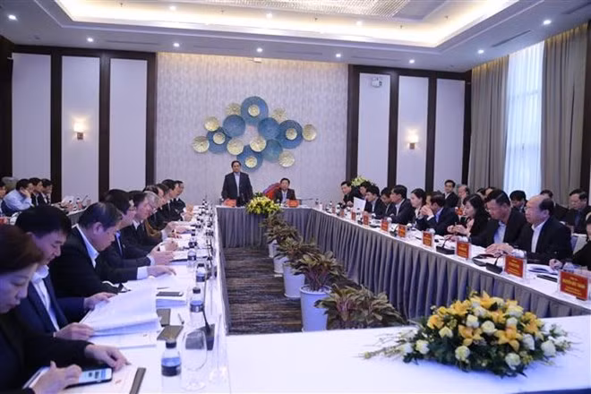 At the working session (Photo: VNA)