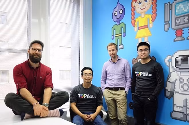 The founders at the Health Innovation Village with their first employee, data scientist Quan Nguyen Minh (right). (Source: Top Data Science)