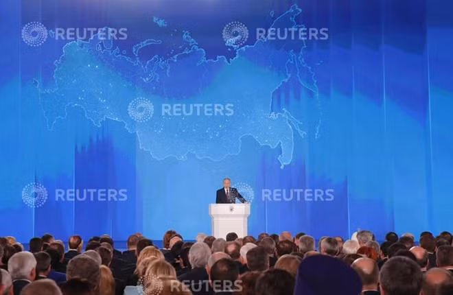 Russian President Vladimir Putin addresses the Federal Assembly, including the State Duma parliamentarians, members of the Federation Council, regional governors and other high-ranking officials, in Moscow, Russia March 1, 2018. REUTERS/Maxim Shemetov