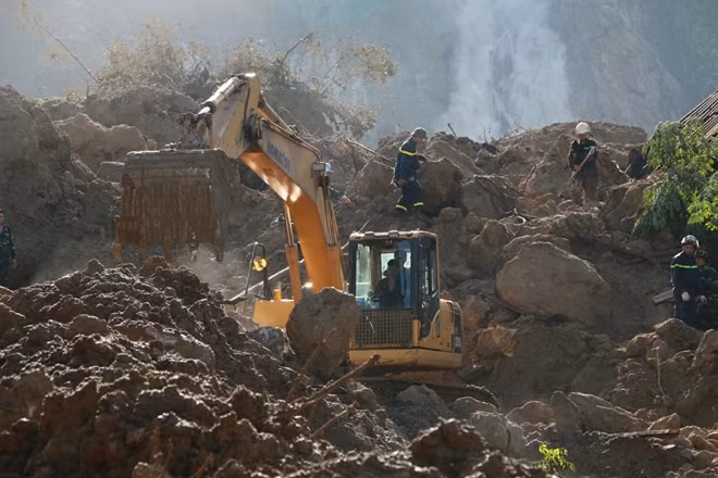 Police officers helping local people overcome consequences by landslide in Hoa Binh