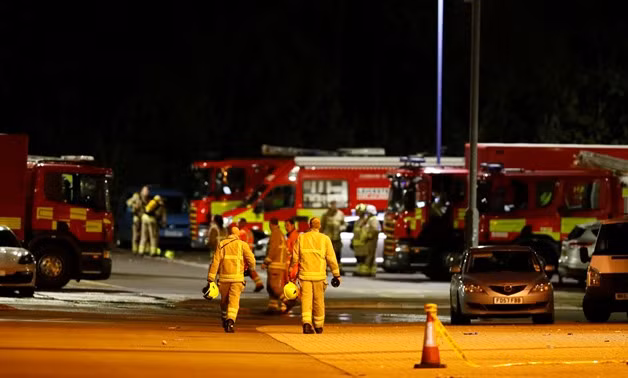 Soccer Football - Premier League - Leicester City v West Ham United - King Power Stadium, Leicester, Britain - October 27, 2018 Firefighters at the scene of where the helicopter belonging to Leicester City owner Vichai Srivaddhanaprabha crashed outside the King Power Stadium Action Images via Reuters/Jason Cairnduff