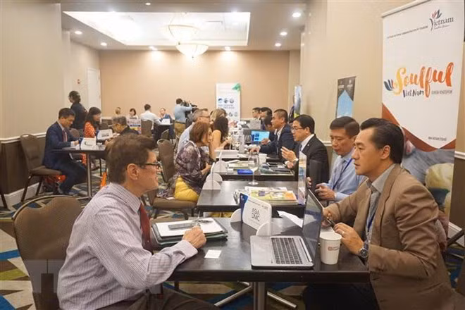 Trave firms of Vietnam and the US seek partnership at the event (Photo: VNA)