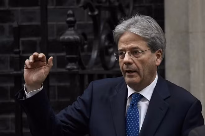 Italy's Prime Minister Paolo Gentiloni waves as he leaves after meeting his counterpart from Britain Theresa May at Number 10 Downing Street in London, February 9, 2017. REUTERS