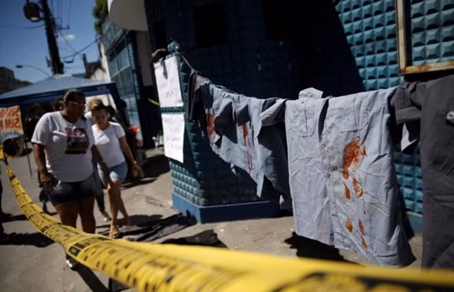 Uniforms placed by family members of police officers in protest for better salaries, are pictured in front of the entrance of the military police battalion in Rio de Janeiro, Brazil February 10, 2017. REUTERS