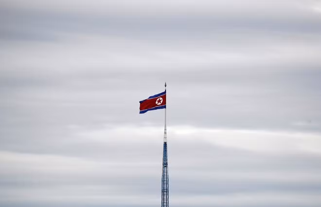 A North Korean flag flutters on top of a 160-metre tower in North Korea's propaganda village of Gijungdong, in this picture taken from the Tae Sung freedom village near the Military Demarcation Line (MDL), inside the demilitarised zone separating the two Koreas, in Paju, South Korea, April 24, 2018. REUTERS
