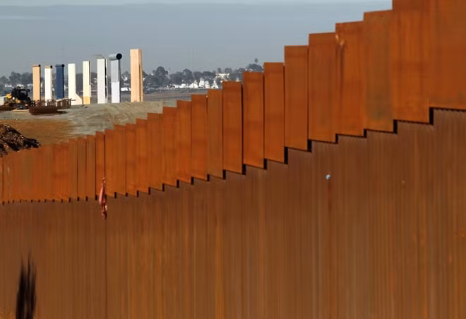 The prototypes for U.S. President Donald Trump's border wall are seen behind the border fence between Mexico and the United States, in Tijuana, Mexico January 7, 2019.