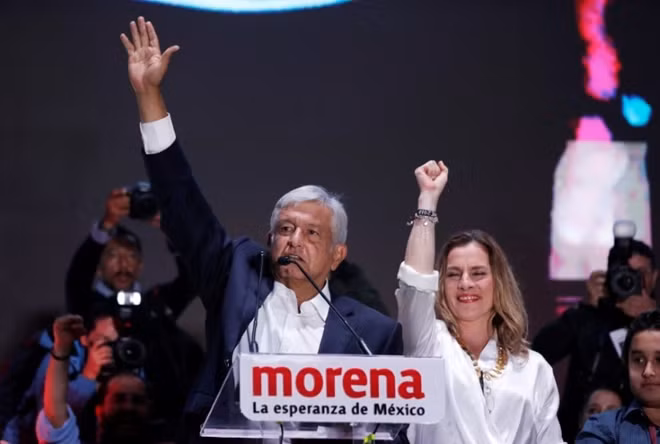 Presidential candidate Andres Manuel Lopez Obrador speaks next to his wife after winning the presidential election, in Mexico City, July 2, 2018. Reuters