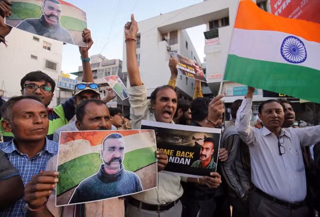 People celebrate before the release of Indian Air Force pilot, who was captured by Pakistan on Wednesday, in a street in Ahmedabad, India, March 1, 2019. REUTERS/Amit Dave