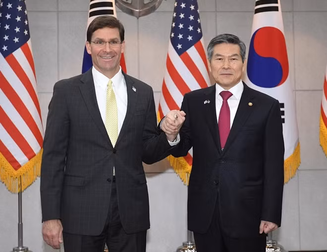 U.S. Defense Secretary Mark Esper (L) clasps hands with South Korean Defense Minister Jeong Kyeong-doo (R) before their meeting on November 15, 2019 in Seoul, South Korea. Kim Min-hee/Pool via REUTERS