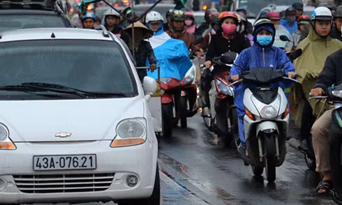 Cars and motorcycles on a street in Danang City