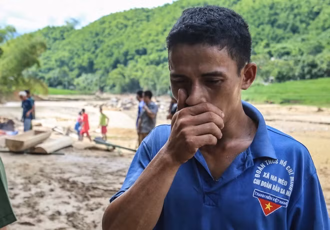 Van in his great pain cannot hold his tears while his relatives and villagers helped bury his son. The boy's body was found in the stream several kilometers away from his house.