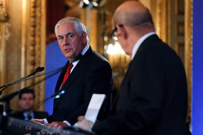 U.S. Secreatry of States Rex Tillerson speaks with French Foreign Affairs Minister Jean-Yves Le Drian as they attend the Lebanon international Support Group meeting in Paris, France, December 8, 2017. Reuters
