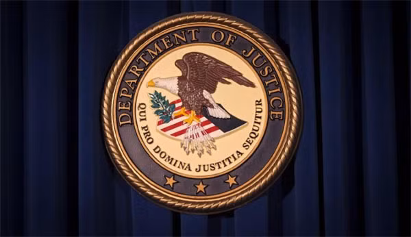 The Department of Justice (DOJ) logo is pictured on a wall in New York, United States, December 5, 2013