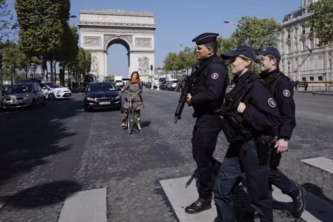 French CRS police patrol the Champs Elysees Avenue the day after a policeman was killed and two others were wounded in a shooting incident in Paris, France, April 21, 2017. REUTERS/Benoit Tessier