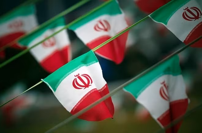 Iran's national flags are seen on a square in Tehran February 10, 2012, a day before the anniversary of the Islamic Revolution. REUTERS/Morteza Nikoubazl/File Photo