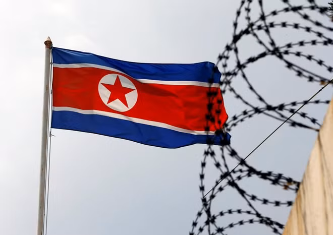 The North Korea flag flutters next to concertina wire at the North Korean embassy in Kuala Lumpur, Malaysia March 9, 2017. REUTERS/Edgar Su