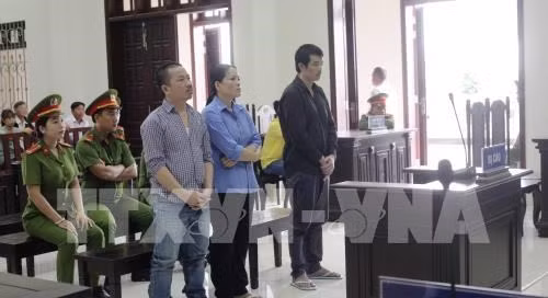 Three defendants (standing) at the first instance trial (Photo: VNA)