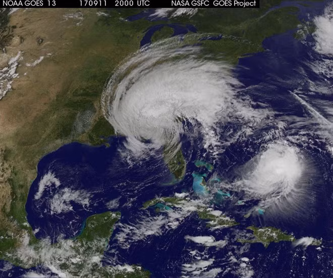 Hurricane Irma, downgraded to a tropical storm on Monday, is shown over Florida, along with Hurricane Jose (R) making a looping path in the western Atlantic Ocean in this NASA GOES satellite image taken at 1600 EDT (2000 GMT) on September 11, 2017. Courtesy NASA/Handout via REUTERS
