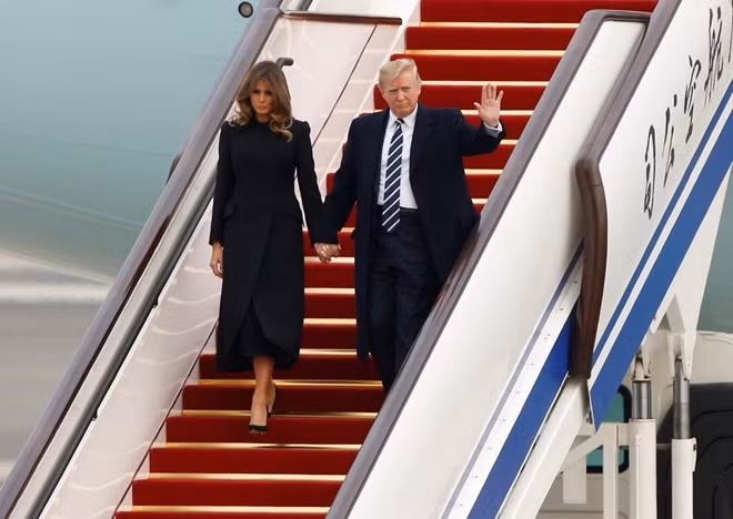 U.S. President Donald Trump and first lady Melania arrive on Air Force One at Beijing, China, November 8, 2017. REUTERS/Thomas Peter