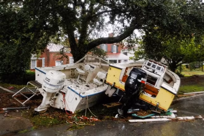 Boats pushed away from the dock are seen on a street during the passing of Hurricane Florence in the town of New Bern, North Carolina, September 14, 2018. REUTERS/Eduardo Munoz