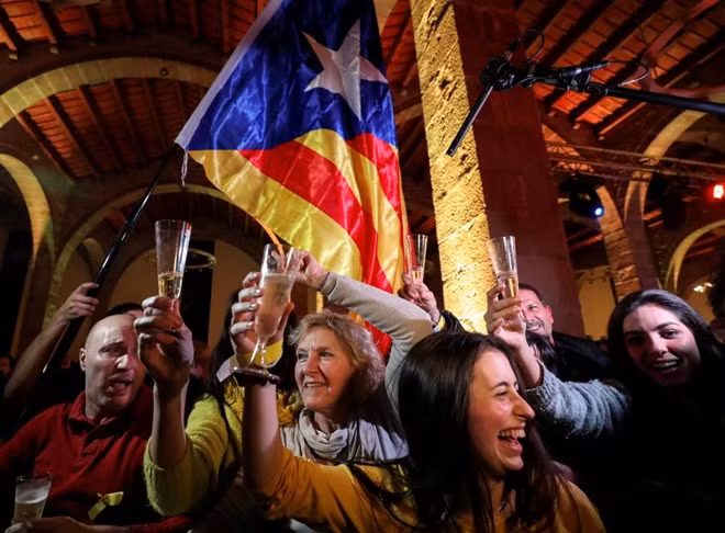 People react to results in Catalonia's regional elections at a gathering of the Catalan National Assembly (ANC) in Barcelona, Spain December 21, 2017. REUTERS/Albert Gea/File Photo