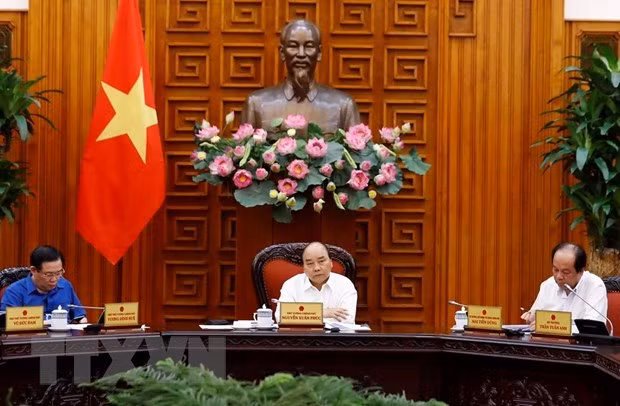 Prime Minister Nguyen Xuan Phuc (centre) at the meeting (Source: VNA) Prime Minister Nguyen Xuan Phuc (centre) at the meeting (Source: VNA)