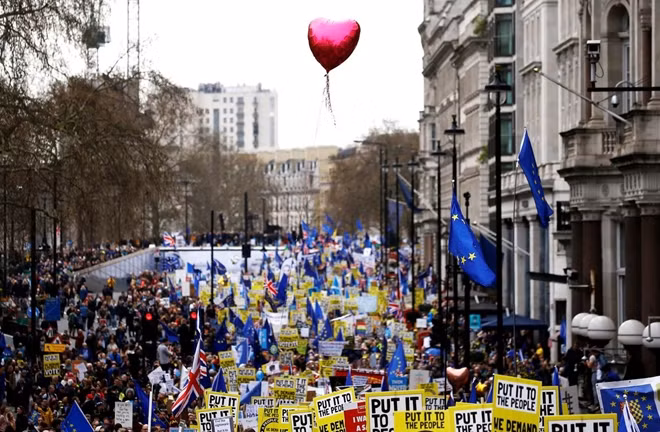 EU supporters, calling on the government to give Britons a vote on the final Brexit deal, participate in the 'People's Vote' march in central London, Britain March 23, 2019.
