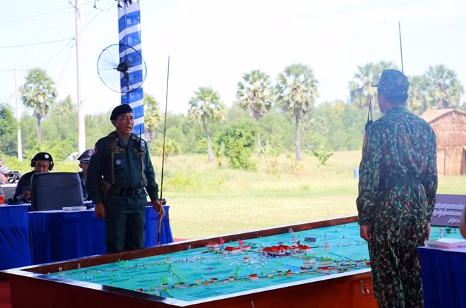 Chiefs of the participating Vietnamese and Cambodian forces meet to discuss a joint combat plan Chiefs of the participating Vietnamese and Cambodian forces meet to discuss a joint combat plan