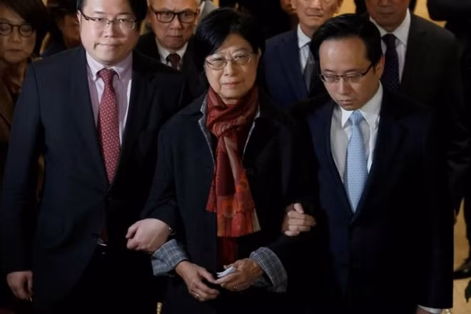 Selina Tsang, wife of former Hong Kong Chief Executive Doanld Tsang, accompanied by sons Simon (L) and Thomas, meets journalists at the High Court in Hong Kong, China February 22, 2017. REUTERS