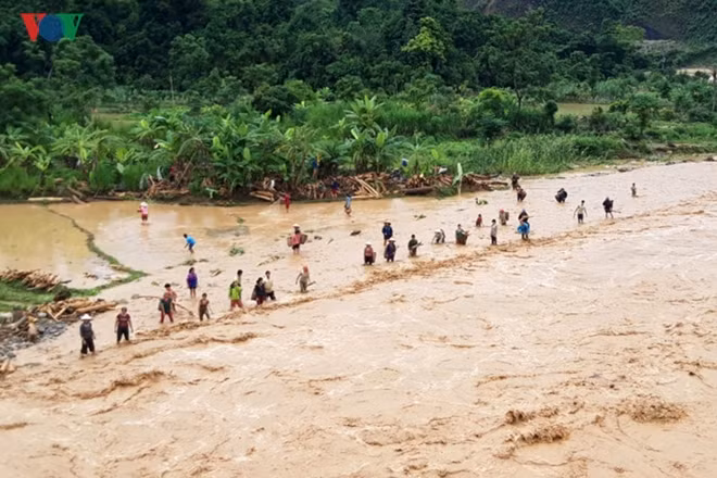 Despite the heavy flooding, some residents attempted to pick up debris from their property