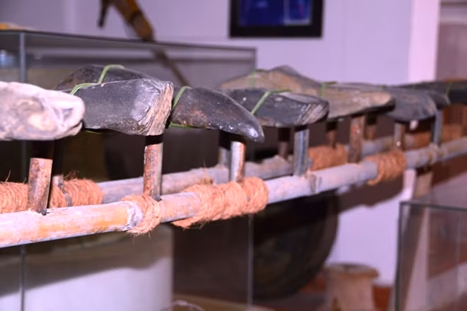 A set of Đàn đá, a type of musical instruments made of stone in the primitive time before the advent of metalware, was collected and preserved perfectly by Tam.