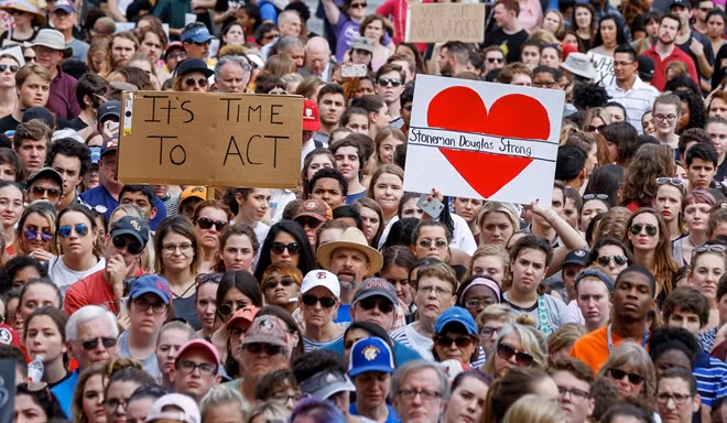 Protestors rally outside the Capitol urging Florida lawmakers to reform gun laws, in the wake of last week's mass shooting at Marjory Stoneman Douglas High School, in Tallahassee, Florida, U.S., February 21, 2018. REUTERS/Colin Hackley