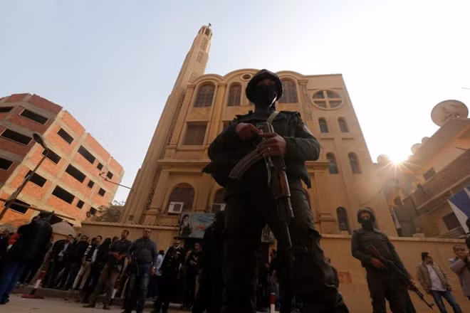 Security forces stand guard at the site of attack on a church in the Helwan district south of Cairo, Egypt December 29, 2017. REUTERS/Amr Abdallah Dalsh