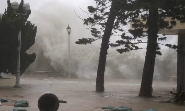 High waves hit the shore at Heng Fa Chuen, a residental district near the waterfront, as Typhoon Mangkhut slams Hong Kong, China, on Sunday. Photograph: Bobby Yip/Reuters High waves hit the shore at Heng Fa Chuen, a residental district near the waterfront, as Typhoon Mangkhut slams Hong Kong, China, on Sunday. Photograph: Bobby Yip/Reuters