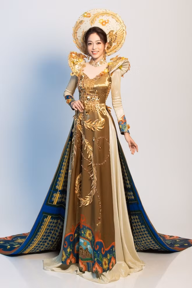 The national costume that Phuong Nga brings to Miss Grand International is called "Ngu Phung Te Phi", using royal gold color as main ton. She also said that the special Ngu Phung Te Phi” is made of brocade and traditional silk.
