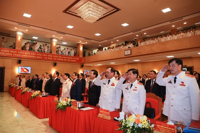 The delegates observe the flag-raising ceremony.