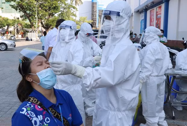 A medical worker collects samples for COVID-19 testing. A medical worker collects samples for COVID-19 testing.