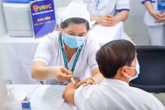 Frontline healthcare workers are the first to be given the AstraZeneca vaccine shot in Vietnam.