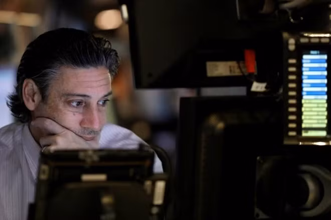 A trader works on the floor of the New York Stock Exchange (NYSE) before the opening bell in the Manhattan borough of New York, U.S. April 4, 2017. REUTERS/Brendan McDermid