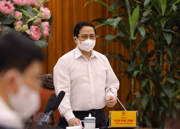 Prime Minister Pham Minh Chinh speaks during an urgent meeting on COVID-19 response in Hanoi on April 30 morning. (Photo: VNA)