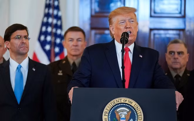U.S. President Donald Trump delivers a statement about Iran flanked by U.S. Defense Secretary Mark Esper, Army Chief of Staff General James McConville and Chairman of the Joint Chiefs of Staff Army General Mark Milley in the Grand Foyer at the White House in Washington, U.S., January 8, 2020.