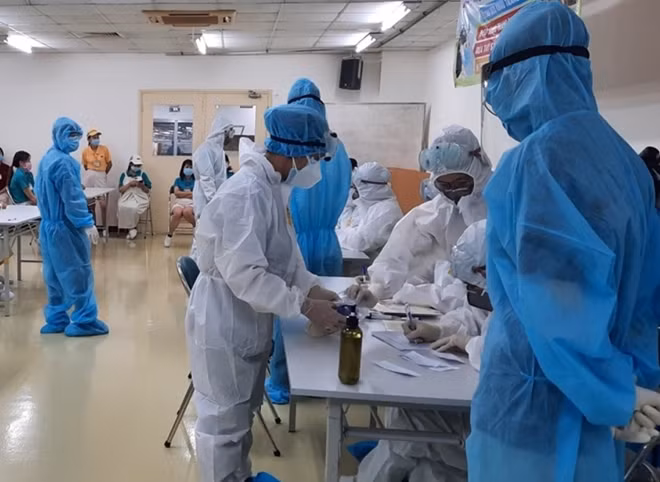 Taking samples, healthcare workers are vulnerable to virus exposure.
