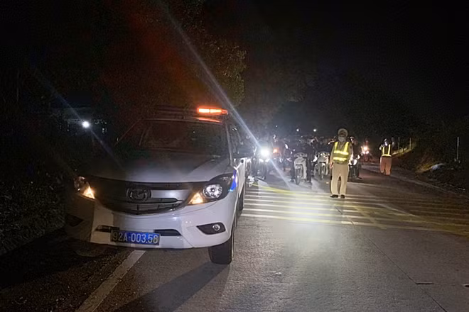 A police car leading the team of travelers at night. A police car leading the team of travelers at night.