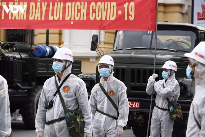 Hundreds of soldiers donning full-protective gear are deployed at various places throughout Hanoi to undertake the task.