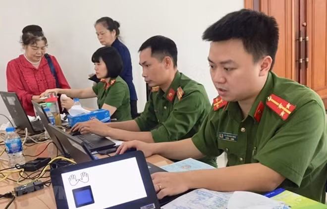 Hanoi police make chip-based ID cards for locals.