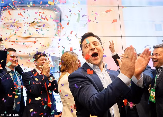 Ukrainian presidential candidate Volodymyr Zelenskiy reacts following the announcement of the first exit poll in a presidential election at his campaign headquarters in Kiev, Ukraine.