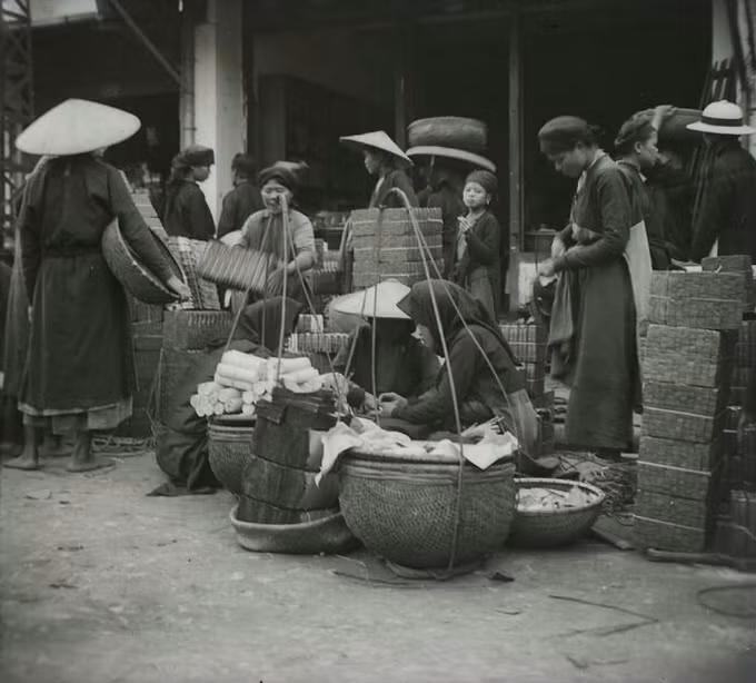 A woman were selling&nbsp;votive paper offerings. The practice of burning them during Tet symbolize how family members continue to remember and care for the deceased, as well as the gods and spirits.